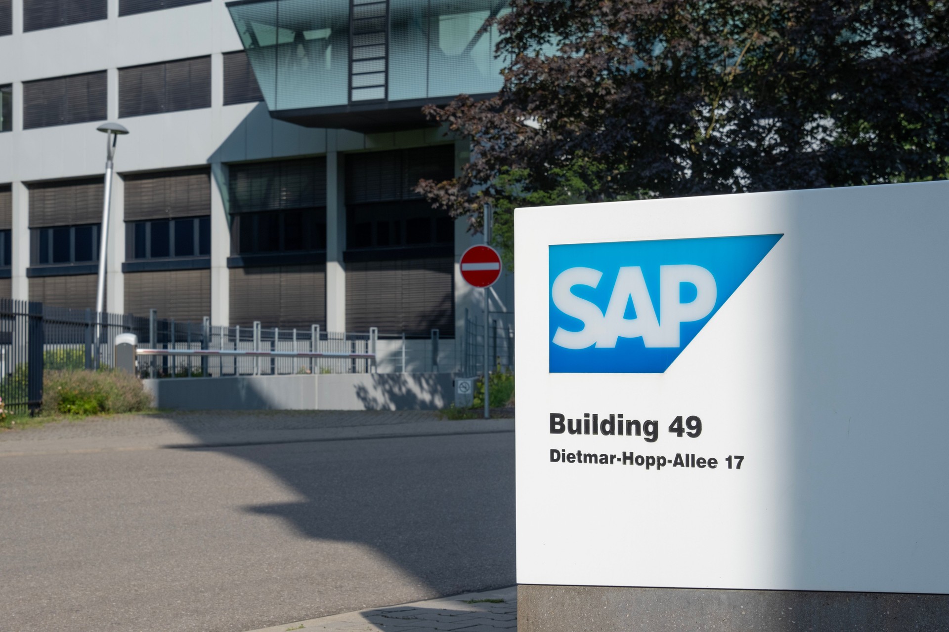 SAP SE logo prominently displayed on modern corporate facade, SAP corporate campus, symbolizing global software industry leadership, Walldorf, Germany - July 29, 2024